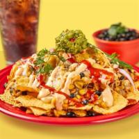 Nachos Combo · Corn tortilla chips topped with melted jack cheese, black beans, roasted corn, red onion, gu...