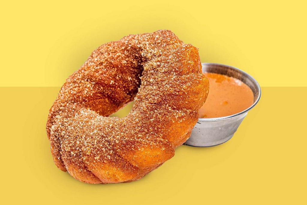 Churro Doughnut · Cinnamon sugar dusted churro doughnut with dulce de leche
