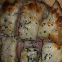 Croque Monsieur Bites · Ham and emmental cheese with bechamel on toasted brioche.