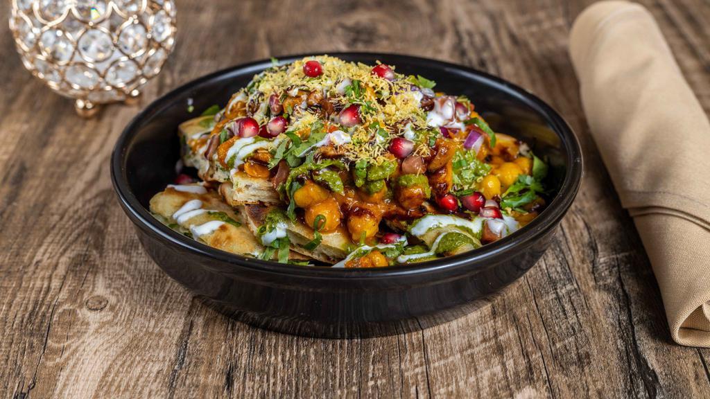 Chaat · Vegetarian. Must Try. Choice of pastry (kulcha / samosa / aloo tikki) topped with delicious chickpeas masala drizzled with yogurt and chutney.