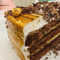 Mocha Cake · Vanilla cake, apricot, and mocha buttercream filling with mocha buttercream icing.