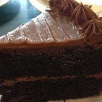 Double Chocolate Cake · Devil's food cake, raspberry, walnut, and chocolate pudding filling with chocolate fudge ici...