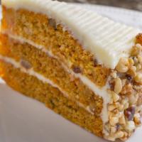 Carrot Cake · Traditional carrot cake filled with cream cheese icing with coconut and cream cheese icing.