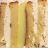 Lemon Coconut Cake · Vanilla cake, lemon cream with toasted coconut filling, lemon buttercream, and shredded coco...