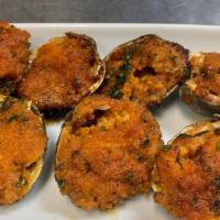 Baked Clams Salamanca · Baked clams filled with shrimps and scallops.