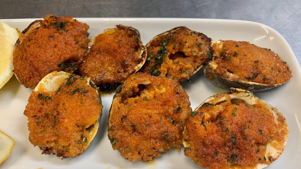 Baked Clams Salamanca · Baked clams filled with shrimps and scallops.