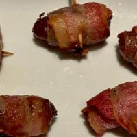Dátiles Con Bacon · Dates wrapped in bacon.