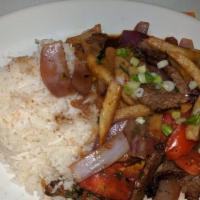 Lomo Saltado · Most popular. Sautéed beef with onions, tomato, and French fries, served with white rice.