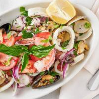 Seafood Salad · Calamari, scungilli, shrimp, fresh tomato, celery, garlic, red onion and fresh herbs.