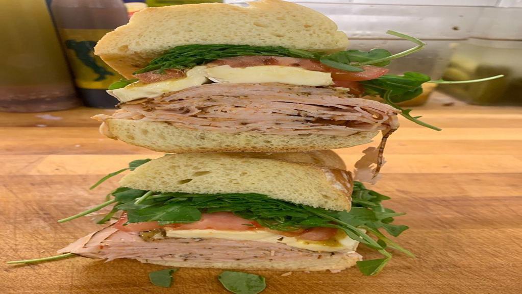 Cajun Roasted Turkey Sandwich · French brie, romaine lettuce, tomato and honey mustard.