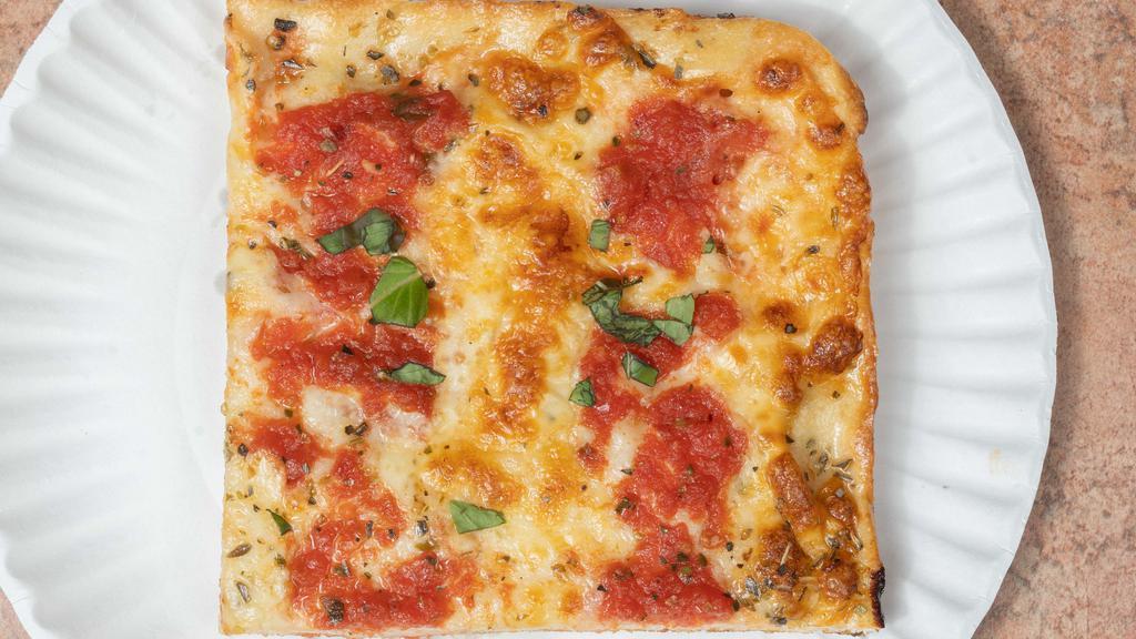 Grandma Pizza · Thin crust with plum tomatoes, fresh garlic and basil.