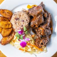 Flava'S Oxtail · Everyone's favorite and most popular dish. Braised oxtails stewed in Jamaican herbs, spices,...