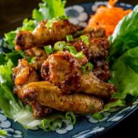 Madame Wings (8 Pieces) · Spicy chicken wings caramelized in a garlic fish sauce.