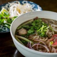 The Madame Pho · Beef broth simmered for twenty four hours, flat rice noodles brisket, rare flank, bone marro...