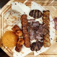 Saray Mix Grill · Combination of doner, chicken shish, lamb shish, meatball, chicken adana, and adana kebab. C...