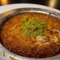Kunefe · Shredded dough stuffed with special mozzarella with syrup and pistachio.