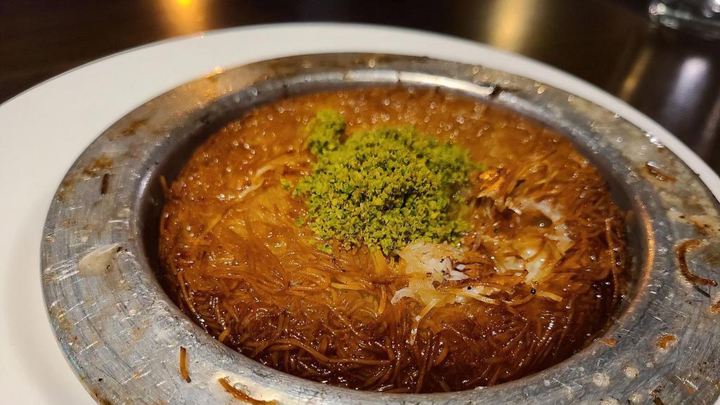 Kunefe · Shredded dough stuffed with special mozzarella with syrup and pistachio.