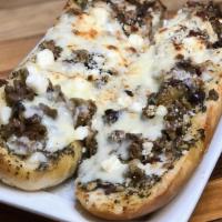 Greek Olive Bread · Topped with a mixed olive salad mixed with romano and feta cheeses