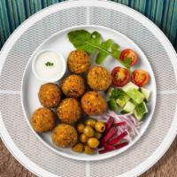 Fell For Falafel · (Four pieces) Baked and fried mixture of garbanzo beans, fava beans, coriander, cumin, parsl...