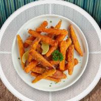 Sweet Spud Fries · Thick-cut sweet potato wedges fried until golden brown.