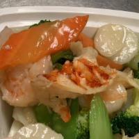 Seafood Combination · Jumbo shrimp, scallops, lobster meat & crab meat with mixed vegetable in delicious white sau...