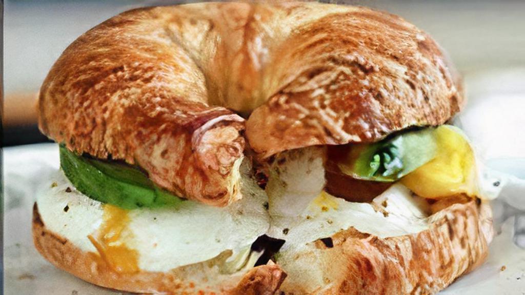 Avocado, Egg & Cheese · A buttery croissant with avocado, two fried eggs and choice cheese.