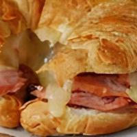 Ham, Egg & Cheese Sandwich · A buttery croissant with sliced ham, two fried eggs and choice of cheese.
