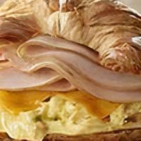 Turkey, Egg & Cheese Sandwich · A buttery croissant with sliced turkey, two fried eggs and choice of cheese.