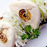 Bao Bao (2 Buns) · Steamed bun with shredded cabbage and cucumber. Served w/ spicy mayo and chef 's chashu sauce.