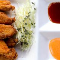 Karaage Chicken Wings · Fried crispy chicken wings with choice of sweet garlic soy sauce or spicy mayo on the side.