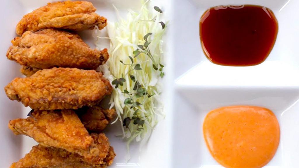 Karaage Chicken Wings · Fried crispy chicken wings with choice of sweet garlic soy sauce or spicy mayo on the side.