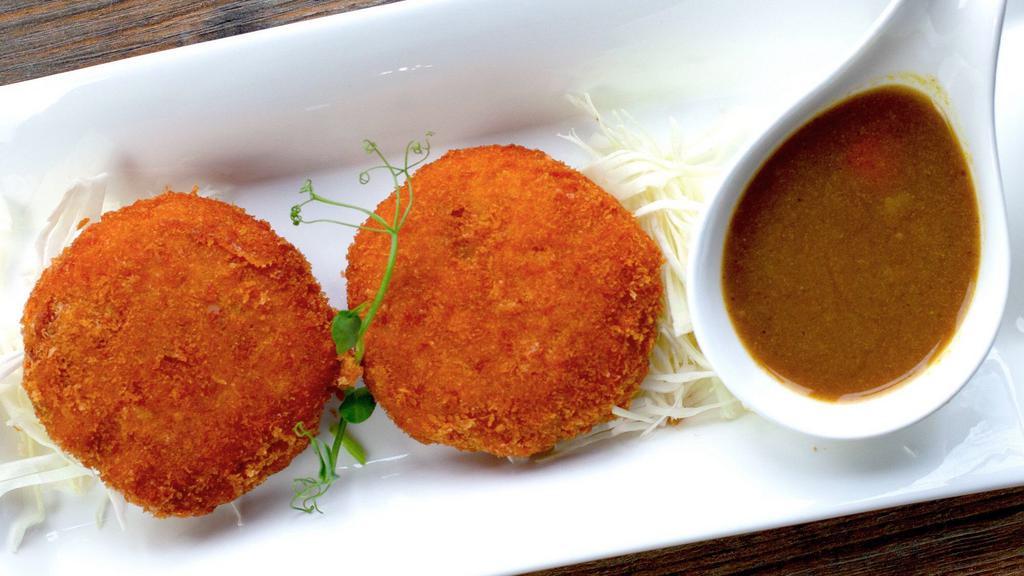 Curry Korokke · Fried mashed pumpkin stuffed with mozzarella or curry chicken. Served with curry sauce on the side.