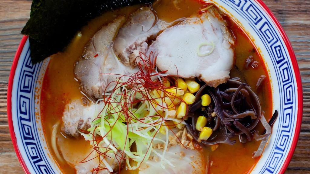 Sum Ramen · Pork chashu, cabbage, wood ear mushroom, corn and crispy onion. Complemented by chicken broth w/ Sum’s house-made hot & spicy paste. (Thick noodles)