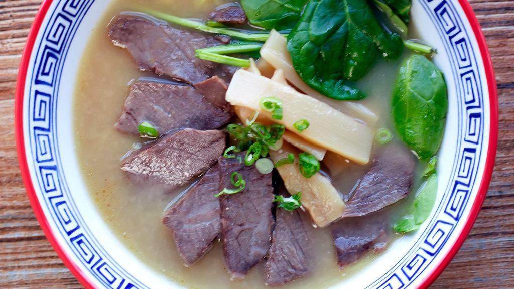 Beef Ramen · Slow cooked beef short ribs, spinach, bamboo shoots and leek. Complemented by beef broth.
