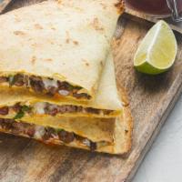 Mixed Meat & Cheese Breakfast Quesadilla · Farm fresh eggs, a combo of juicy meats, and melted cheese folded into a warm flour tortilla...