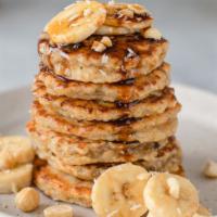 Banana Pancakes · Fresh pancakes hot off the griddle, with fresh bananas, dusted with powdered sugar and serve...
