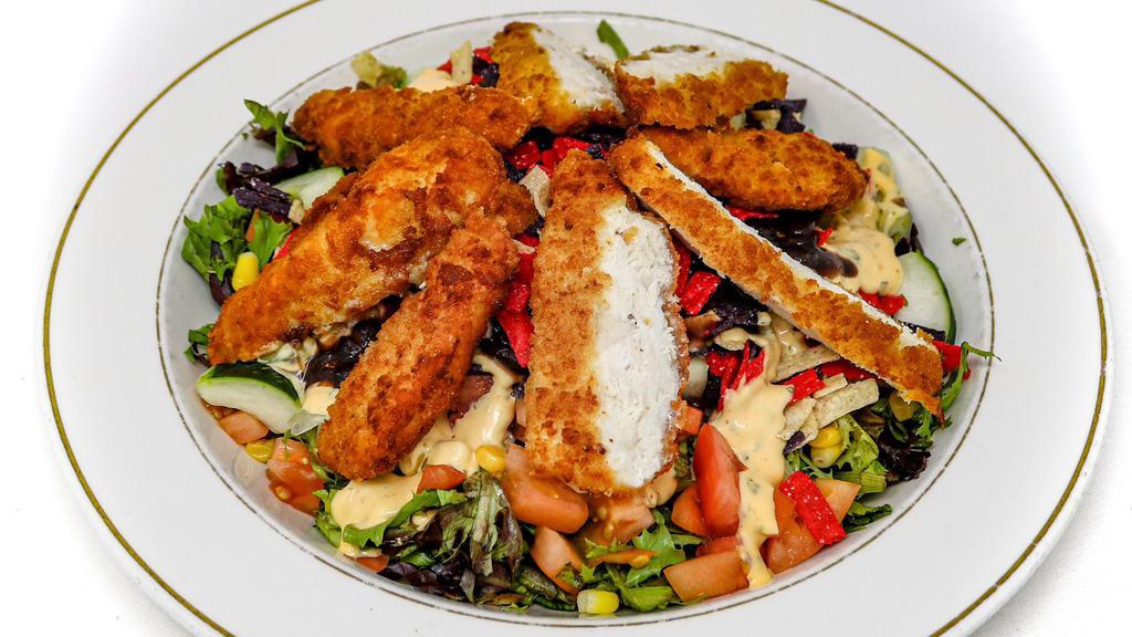 Southwest Chicken Salad · California spring mixed with tomatoes, cucumber, corn, black beans, crispy tortilla strips & sliced breaded chicken breast. With cilantro ranch dressing