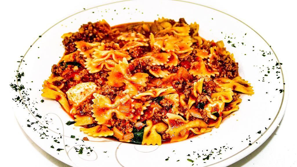 Farfalle Bolognese · Farfalle pasta with meat sauce, basil & fresh mozzarella
