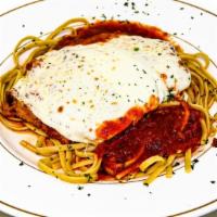 Chicken Parmigiana · Breaded chicken breast topped with marinara sauce & melted mozzarella cheese. Served over li...