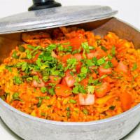 Arroz Con Pollo · Rice stew with onions, peppers, tomatoes, olives and cilantro.
