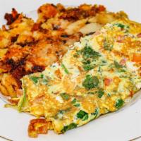Florentine Omelette · Fresh spinach, tomatoes and feta cheese