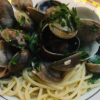 Spaghetti Vongole · Manila clams, roasted garlic, Italian parsley, peperoncino, olive oil.