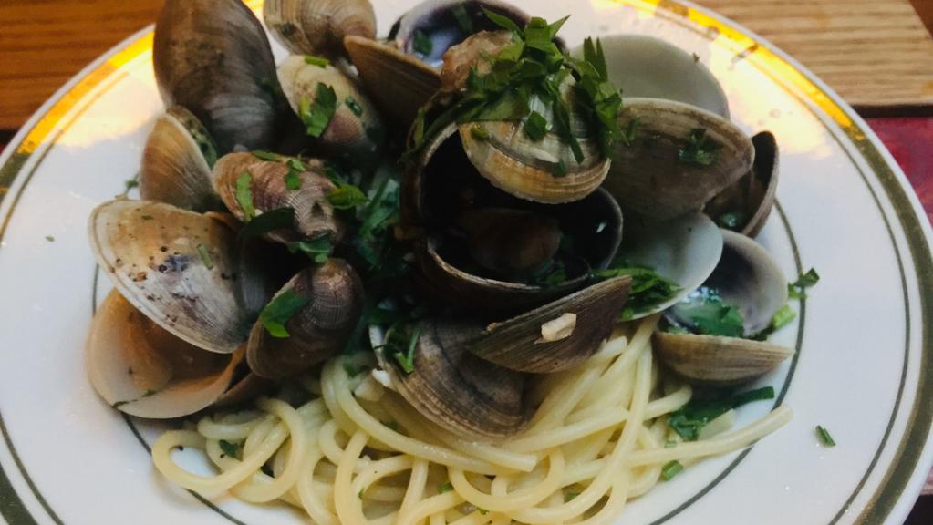 Spaghetti Vongole · Manila clams, roasted garlic, Italian parsley, peperoncino, olive oil.