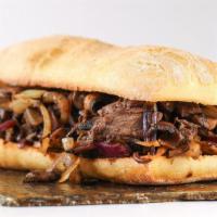 Buffalo Steak House Panini · An exquisite sandwich made with juicy philly steak, american cheese, buffalo sauce, onions, ...