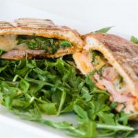 Metro Panini · An exquisite sandwich made with fresh honey turkey, Swiss cheese, lettuce, and Swiss peppers...