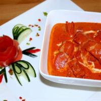Royals Of Punjab Butter Chicken · Marinated chicken cubes are first cooked in the clay oven, then finished in a spiced creamy ...