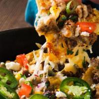 Mexican Loaded Nachos · Spicy. Gluten free. Cheese, pulled pork, pickled jalapeno pepper, black bean, corn, pico de ...