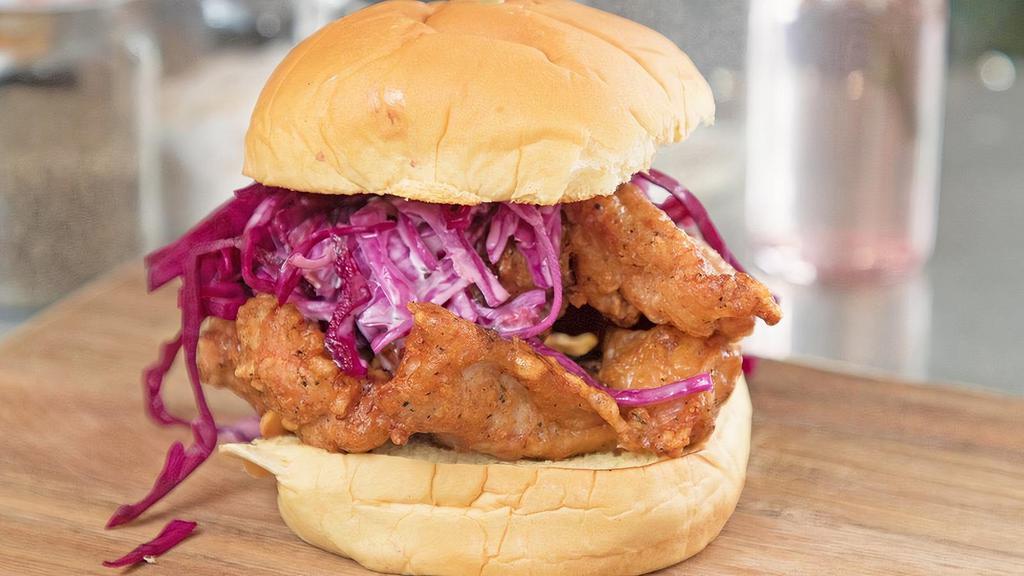 Buttermilk Fried Chicken Burger · Spicy. Fried, breaded chicken thigh, coleslaw, pickled cabbage, chipotle, mayo, house sauce. Classic martin's potato bun. Thigh meat.