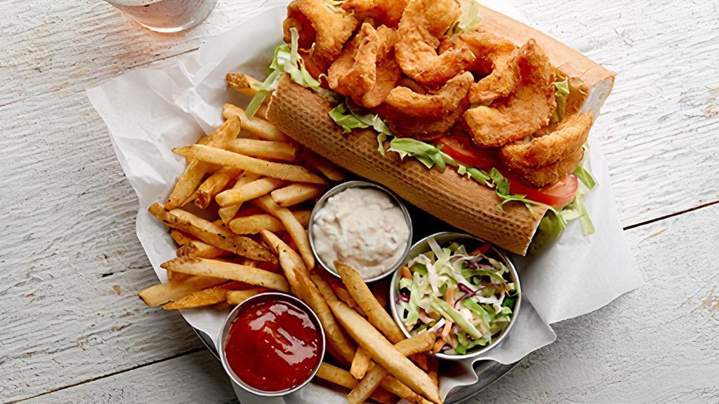 Fish Po Boy W. Salad  · Crispy battered crunchy tilapia fillet, buttered French roll, cabbage, tomato, lettuce, house remoulade sauce