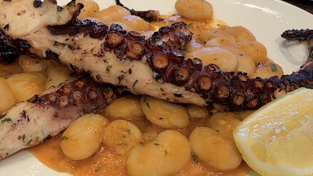 Grilled Octopus · Heart smart low fat dish. Gigante bean ragu, fresh herbs, Sicilian extra virgin olive oil and fresh lemon.
